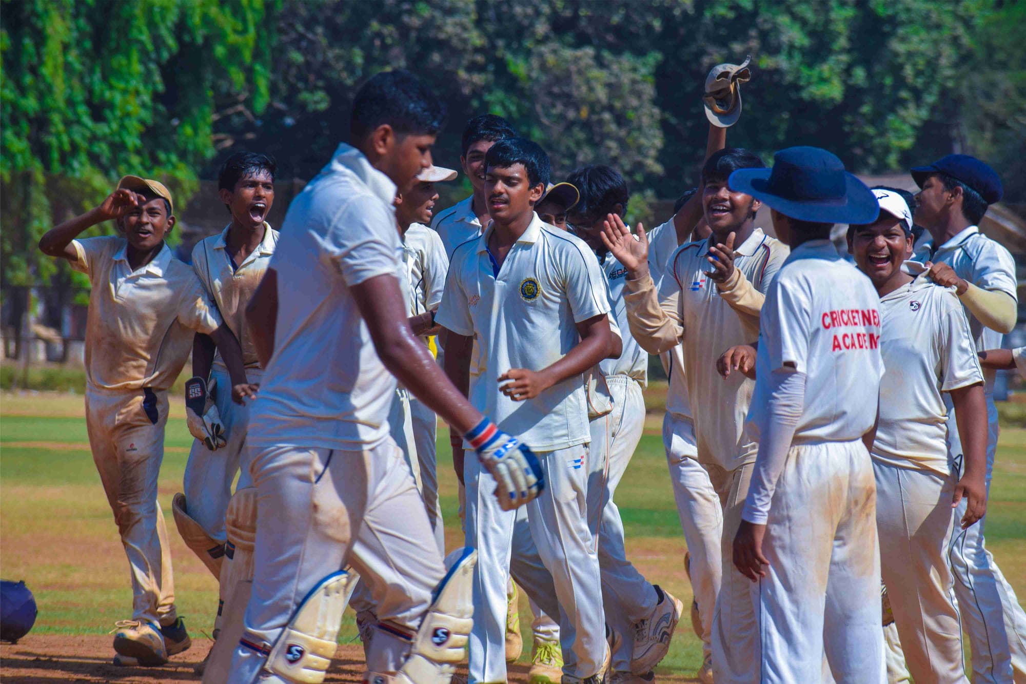 Academy players celebrating together during a match